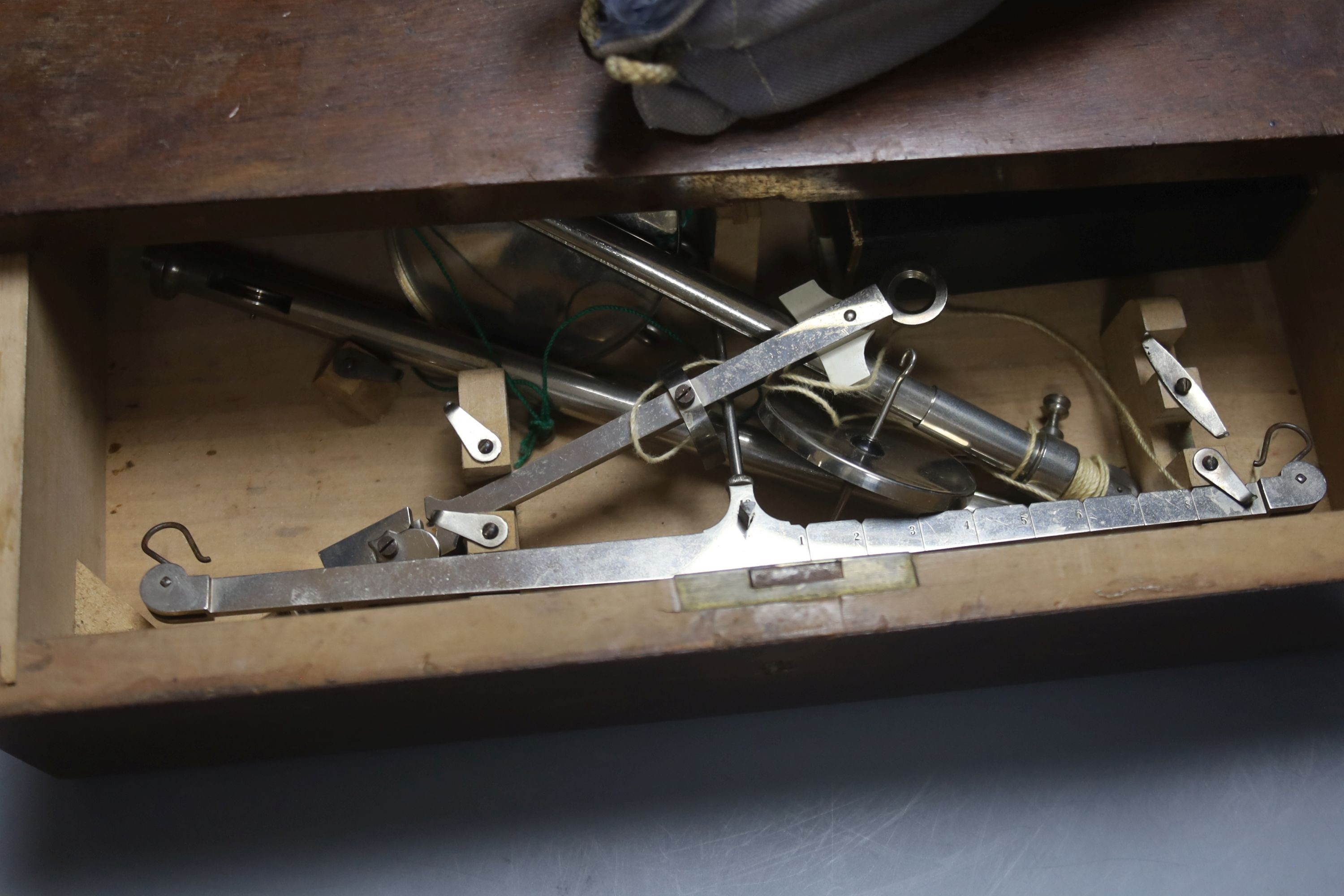 A pair of mother of pearl opera glasses and a pair of beam scales